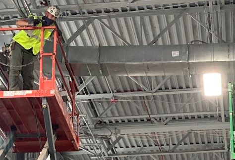 Matt Roldan and Joe Hart on lifts working on ducts