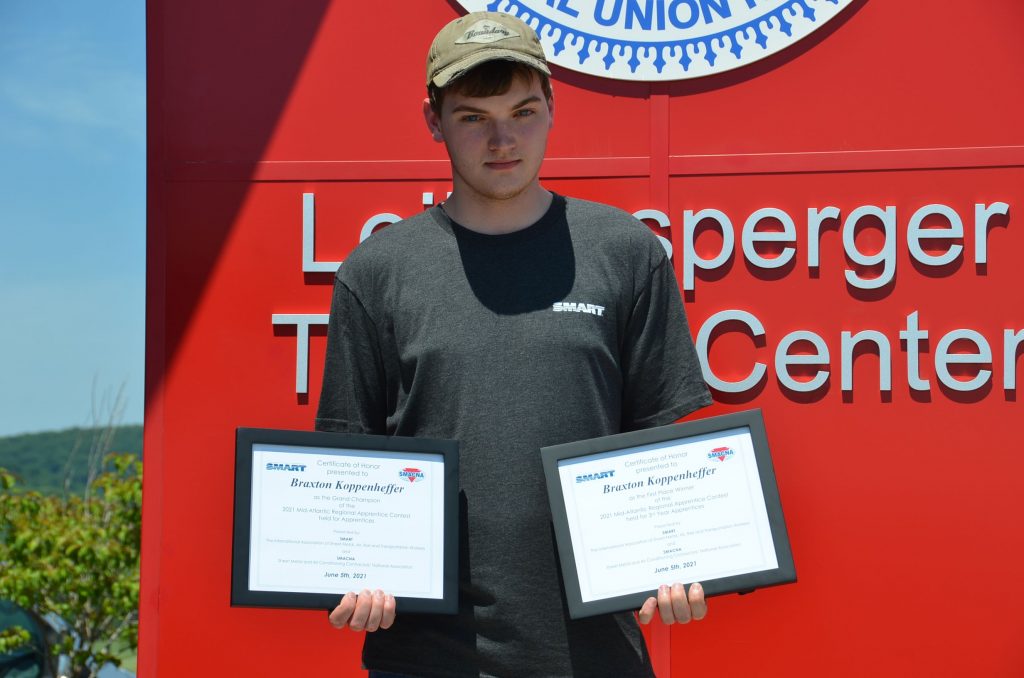 Braxton Koppenheffer receiving his two awards