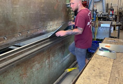 Sheet Metal Worker bending metal sheets