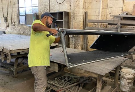 Sheet Metal Worker assembling a large project