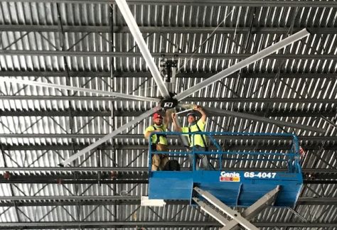 Sheet Metal Workers on a lift working on a giant fan
