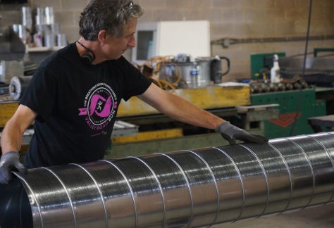 Sheet Metal Worker adjusting some duct work