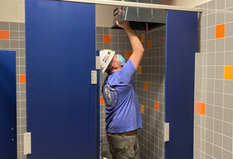 Sheet Metal Worker adjusting vents