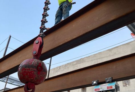 Sheet Metal Worker on a metal beam